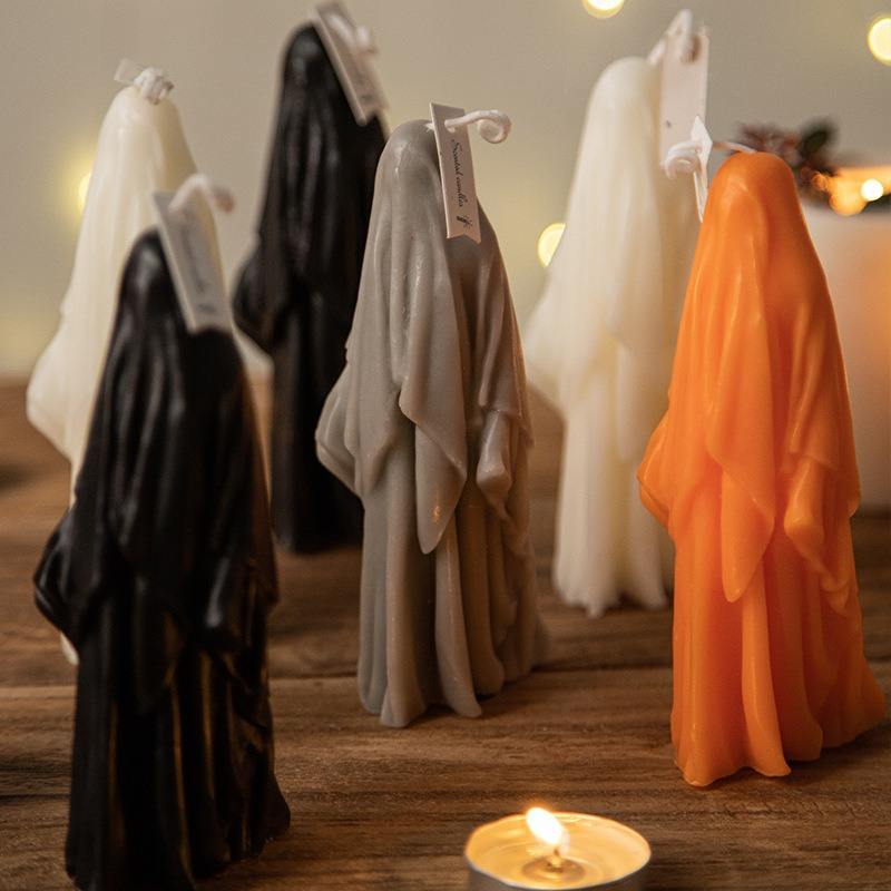 Halloween black, white, gray and orange scary ghost shaped candle decorations