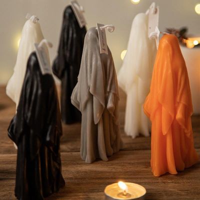 Halloween black, white, gray and orange scary ghost shaped candle decorations