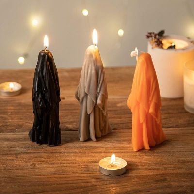 Halloween black, white, gray and orange scary ghost shaped candle decorations