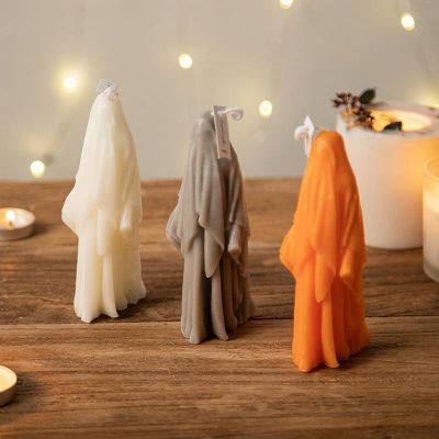 Halloween black, white, gray and orange scary ghost shaped candle decorations